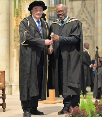 Dr. Chris Emeruwa, receiving his MBA certificate from the Pro-Chancellor