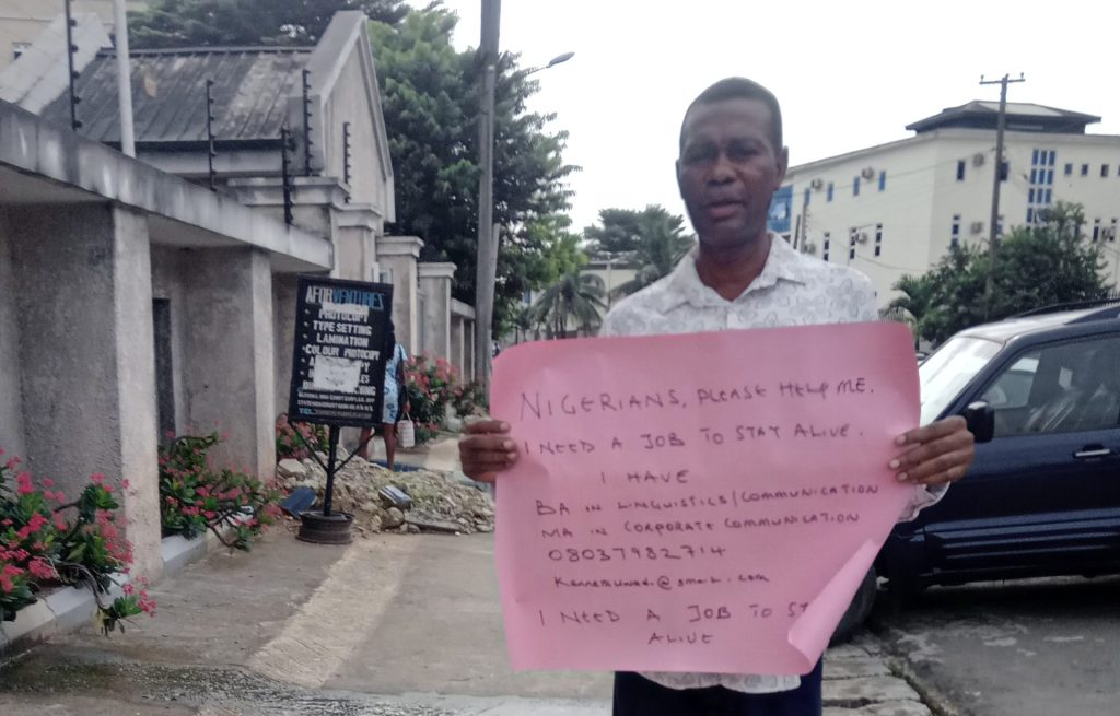 Graduate Hits Port Harcourt Street, Begs For A Job Man-begs-for-job
